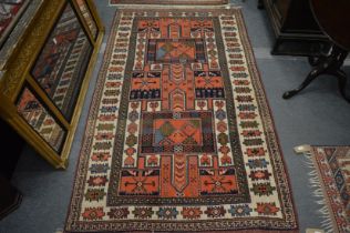 A Persian rug, blue and rust ground with all-over stylised decoration 205cm x 120cm.