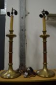 A large pair of brass and leather table lamps.