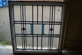 Three stain glass leaded light windows.