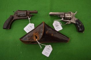 An early percussion pistol with leather holster together with a small relic pistol.