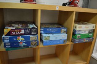 A quantity of jigsaw puzzles.