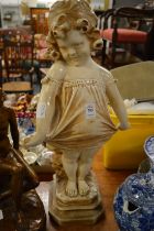 Pottery group of a young girl and another figurine.