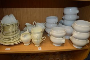 A part tea service and a collection of soup bowls.