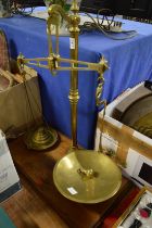 A large set of brass weighing scales.