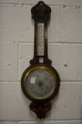 An oak cased aneroid barometer and thermometer.