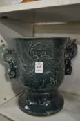 A large Chinese twin handled pottery vase.