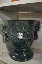 A large Chinese twin handled pottery vase.