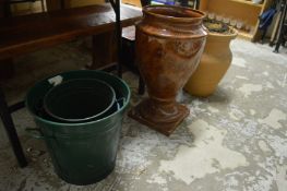 A large pottery vase and other items.