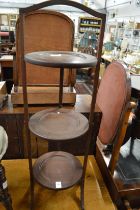 A mahogany folding cake stand.