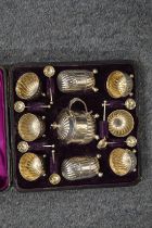 A cased silver cruet set.