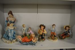 A group of Capodimonte figures.