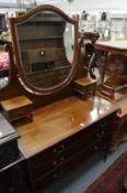 An Edwardian mahogany dressing chest.