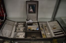 A jewellery case containing a quantity of bijouterie.
