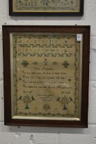 A 19th century sampler with alphabet, flowers, birds and text, signed Mary Ann Dalton August 28th