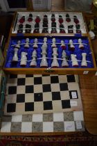 Boxed chest set and chess boards.