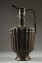 A FINE LATE 12TH CENTURY KHURASAN PERSIAN SILVER AND COPPER INLAID BRASS EWER, the sheet metal