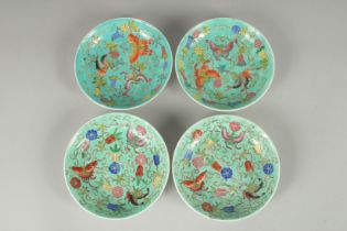 A SET OF FOUR TURQUOISE DISHES.