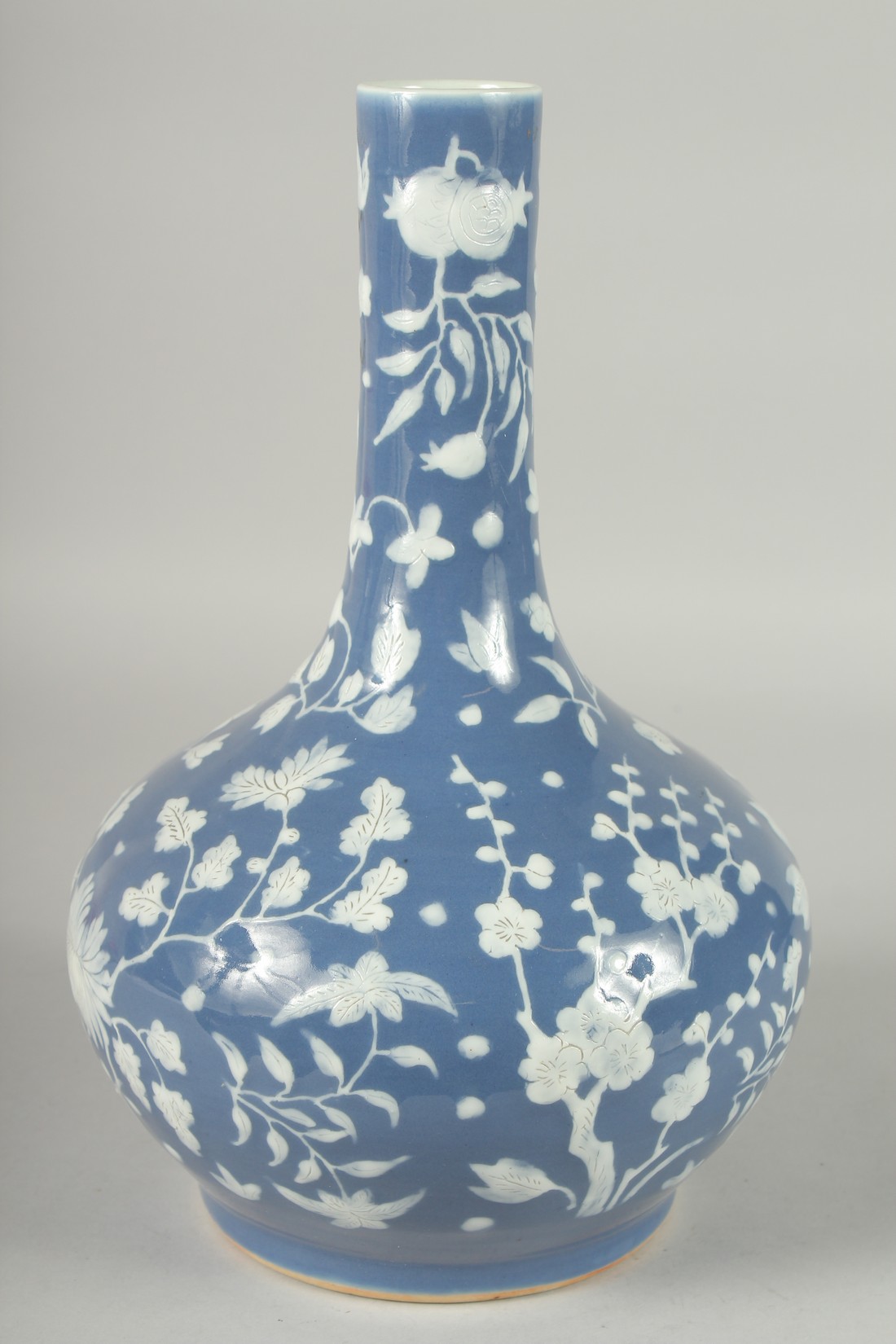 A CHINESE BLUE GROUND PORCELAIN VASE, with carved floral decoration in white, 34cm high. - Image 3 of 5