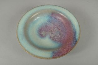 A SMALL CHINESE JUN STYLE SAUCER DISH, 10cm diameter.