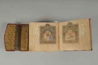 A 19TH CENTURY MOROCCAN LEATHER BOUND ILLUMINATED COLLECTION OF PRAYERS INCLUDING DALA'IL AL-