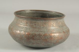 AN EARLY 18TH CENTURY PERSIAN SAFAVID TINNED COPPER BOWL, with engraved calligraphy, 22cm diameter.