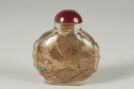A CHINESE REVERSE GLASS PAINTED SNUFF BOTTLE AND STOPPER, 6.5cm high.