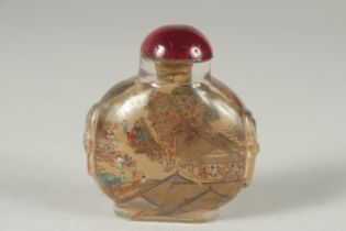 A CHINESE REVERSE GLASS PAINTED SNUFF BOTTLE AND STOPPER, 6.5cm high.