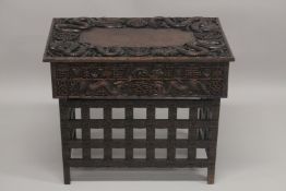 AN EARLY 20TH CENTURY CHINESE HARDWOOD FOLDING DESK / TABLE, with two small drawers and folding