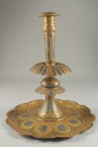 A LARGE 19TH CENTURY PERSIAN QAJAR SILVER INLAID ENAMELLED BRASS CANDLESTICK, 39cm high.