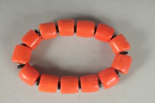 A FAUX CORAL BRACELET.