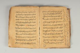 AN ISLAMIC INDO PERSIAN LEATHER BOUND BOOK ON HADITH, 17.5cm x 13cm.