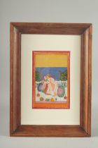 AN INDIAN EROTIC MINIATURE PAINITNG, framed and glazed, image 22.5cm x 15cm.