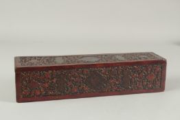 A RARE 18TH CENTURY MUGHAL INDIAN CARVED PAINTED AND LACQUERED WOODEN PEN BOX, 36cm x 9cm.