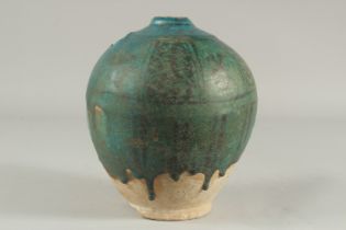 A 13TH CENTURY PERSIAN KASHAN TURQUOISE GLAZED JUG, (neck and handle missing), 23cm high.