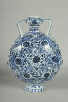 A CHINESE BLUE AND WHITE PORCELAIN TWIN HANDLE MOON FLASK VASE, 27.5cm high.