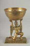 A FINE 19TH CENTURY INDIAN BRASS OFFERING BOWL WITH A GARUDA BASE, 17.5cm high.