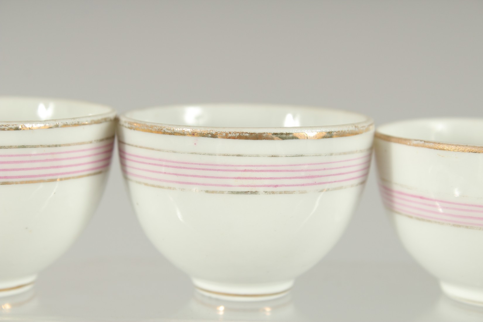 FOUR RUSSIAN PORCELAIN CUPS MADE FOR THE QAJAR MARKET (4). 5.5cm diameter. - Image 3 of 6