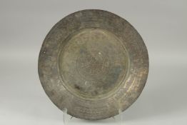 A MIDDLE EASTERN ENGRAVED TINNED COPPER DISH, 43cm diameter.