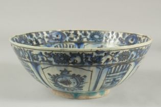 A 17TH-18TH CENTURY PERSIAN SAFAVID GLAZED POTTERY BLUE AND WHITE BOWL, with signature at the