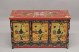 A 20TH CENTURY CHINESE PAINTED LOW CUPBOARD, the rectangular top painted with flowers, similarly