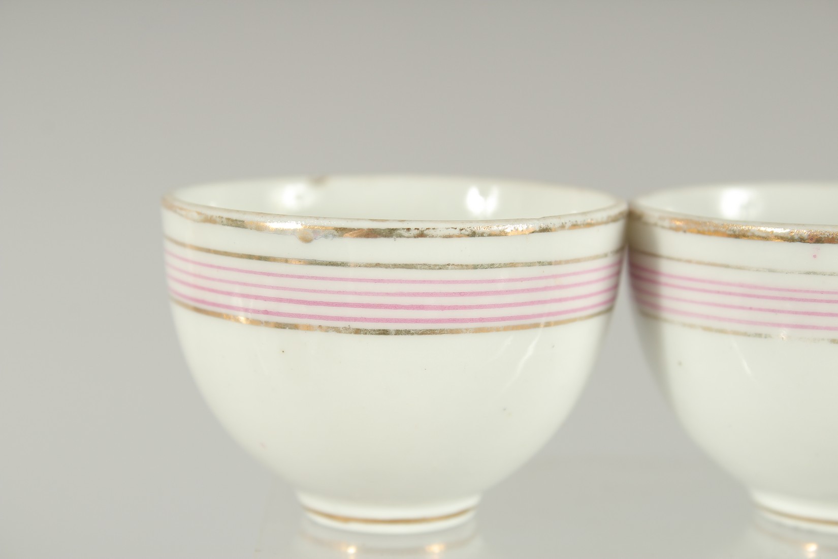 FOUR RUSSIAN PORCELAIN CUPS MADE FOR THE QAJAR MARKET (4). 5.5cm diameter. - Image 2 of 6