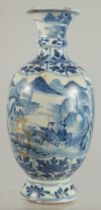 A CHINESE BLUE AND WHITE PORCELAIN VASE, decorated with landscape scenes and bands of floral motifs,