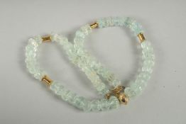 AN INDIAN ROCK CRYSTAL AND GLASS BEADED NECKLACE, with 18ct gold clasps.