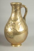 A JAPANESE BRASS JUG, with relief foliate decoration, 23cm high.
