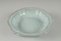 A CHINESE LIGHT BLUE MONOCHROME GLAZED FOOTED DISH, 19.5cm wide.