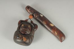 A JAPANESE MEIJI CARVED WOOD FIGURAL POUCH / BOX, with large toggle, the figure with draw-string