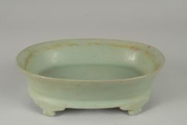 A CHINESE RU WARE OVAL-FORM PLANTER, raised on four legs, 22.5cm x 16.5cm.