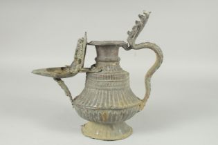 AN INDIAN METAL EWER / OIL LAMP, 28cm high.