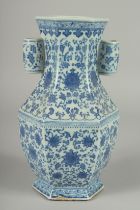 A CHINESE BLUE AND WHITE PORCELAIN HEXAGONAL VASE, with twin cylindrical tubed handles and lotus