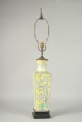 A CHINESE FAMILLE JAUNE PORCELAIN SQUARE-FORM VASE, converted to a lamp, painted with blossoming